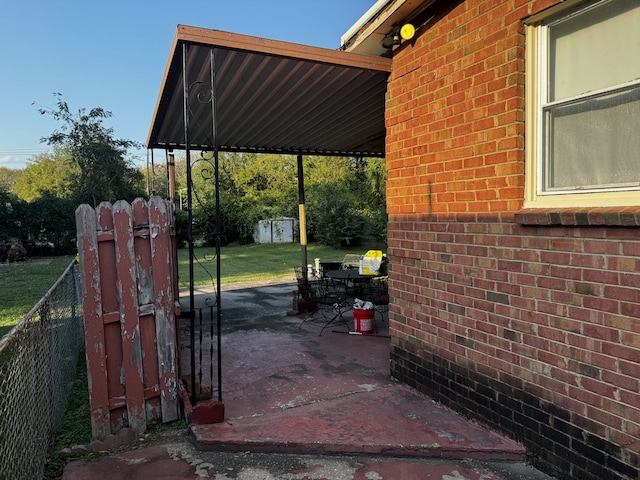 view of patio featuring a storage shed