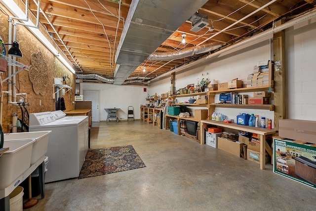 basement featuring sink and washer and dryer