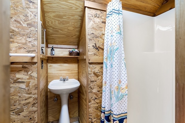 bathroom with lofted ceiling