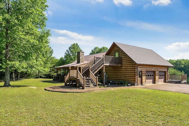 exterior space with a garage and a lawn