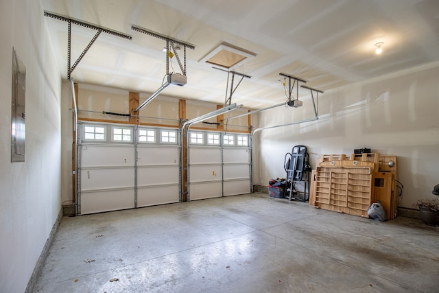 garage featuring a garage door opener and electric panel