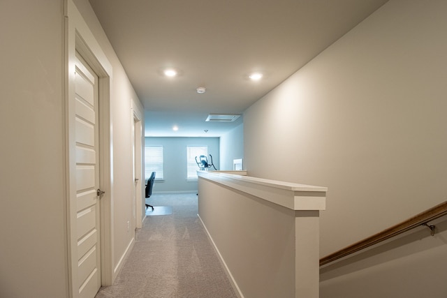 corridor with light carpet