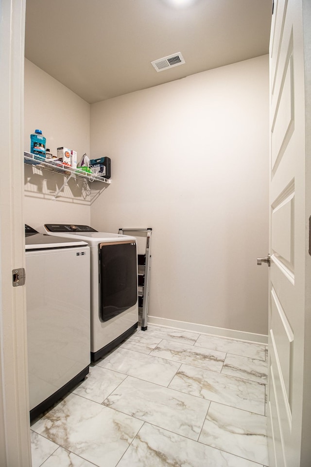 laundry room with washing machine and dryer