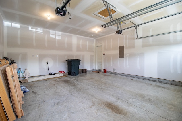 garage featuring electric panel and a garage door opener