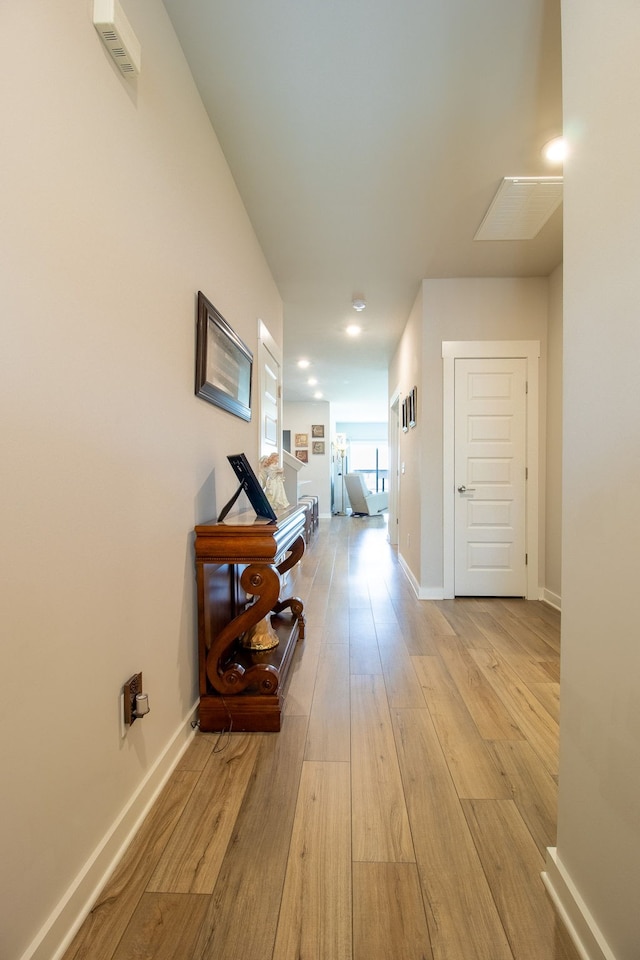 corridor featuring light hardwood / wood-style floors