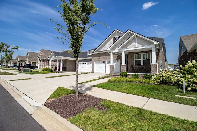 craftsman-style house featuring a garage and a front lawn