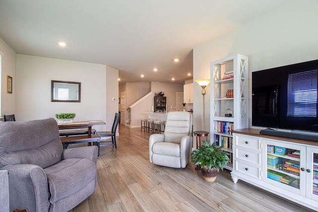 living room with light hardwood / wood-style flooring