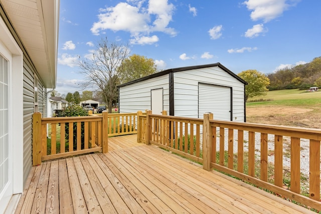 wooden deck featuring an outbuilding and a garage