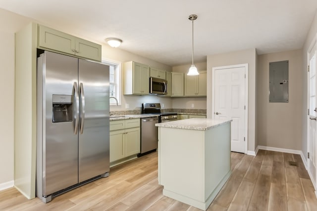 kitchen featuring stainless steel appliances, light hardwood / wood-style floors, green cabinets, decorative light fixtures, and electric panel