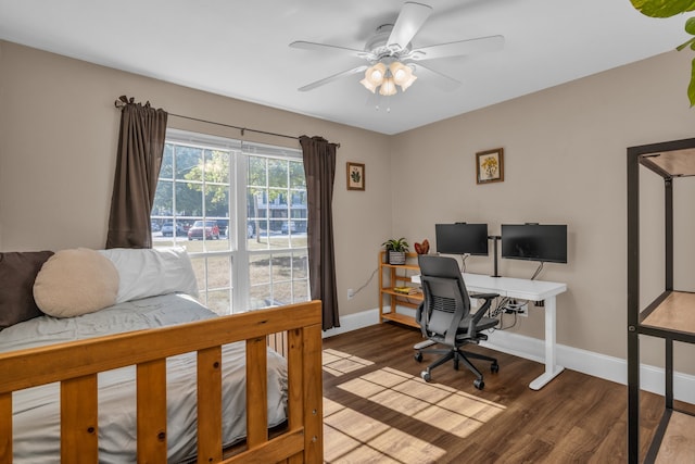 bedroom with ceiling fan and hardwood / wood-style flooring