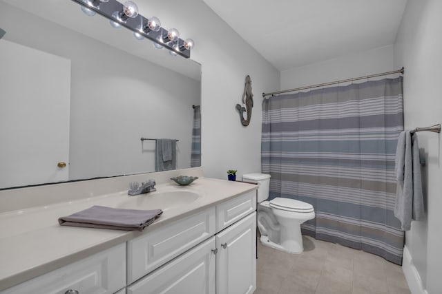 bathroom featuring vanity, tile patterned flooring, toilet, and a shower with shower curtain