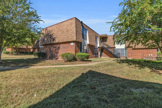 view of property exterior featuring a yard