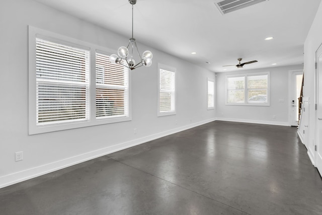 unfurnished dining area featuring ceiling fan with notable chandelier