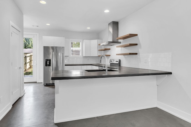 kitchen featuring a healthy amount of sunlight, stainless steel refrigerator with ice dispenser, and white cabinetry