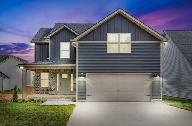 view of front facade featuring a garage and covered porch