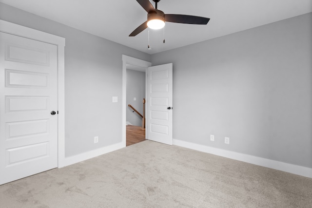 unfurnished bedroom with carpet and ceiling fan