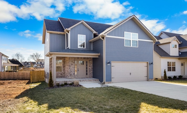 view of front of house featuring a garage, a porch, and a front yard