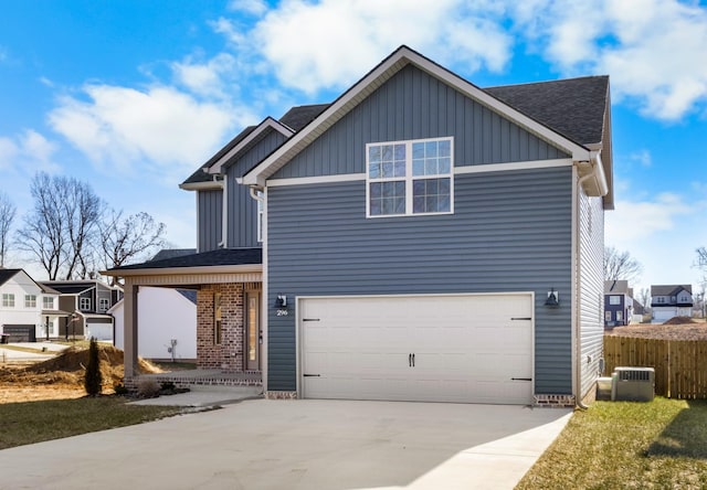 view of front of property featuring a garage and a front yard