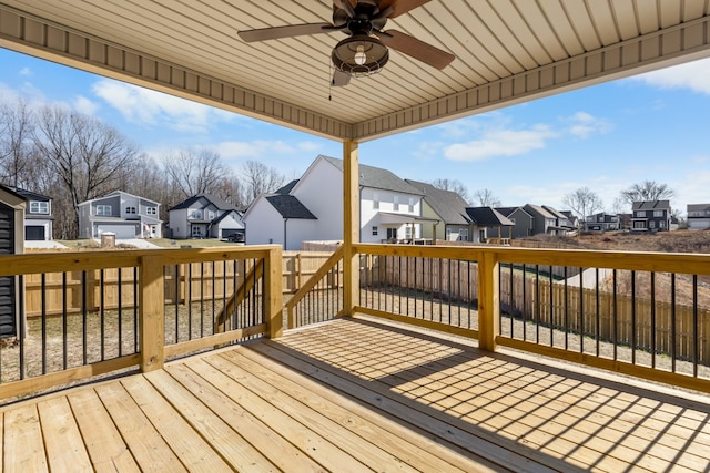 wooden deck featuring ceiling fan