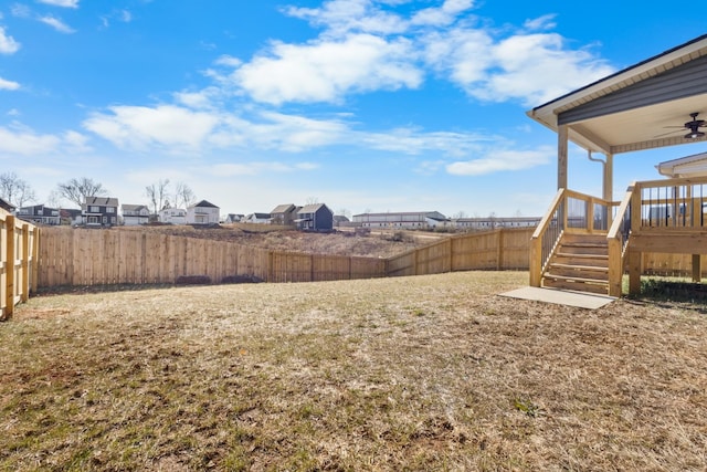 view of yard featuring ceiling fan