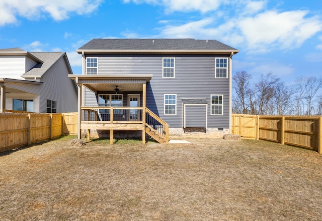 back of house featuring a wooden deck and ceiling fan