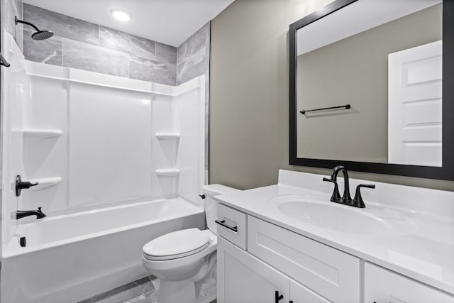 full bathroom featuring vanity, tub / shower combination, and toilet