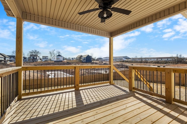 wooden deck featuring ceiling fan