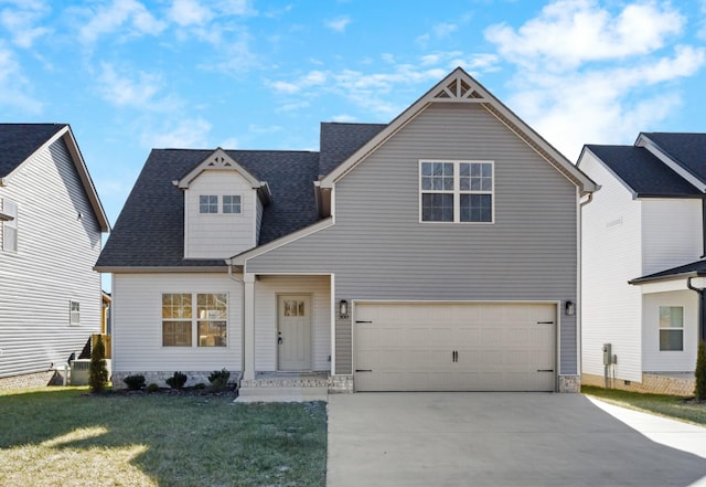 view of front of house with a garage and a front yard