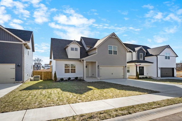 view of front property with a garage and a front lawn