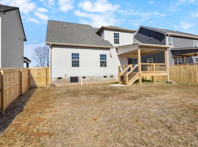 back of property with a wooden deck