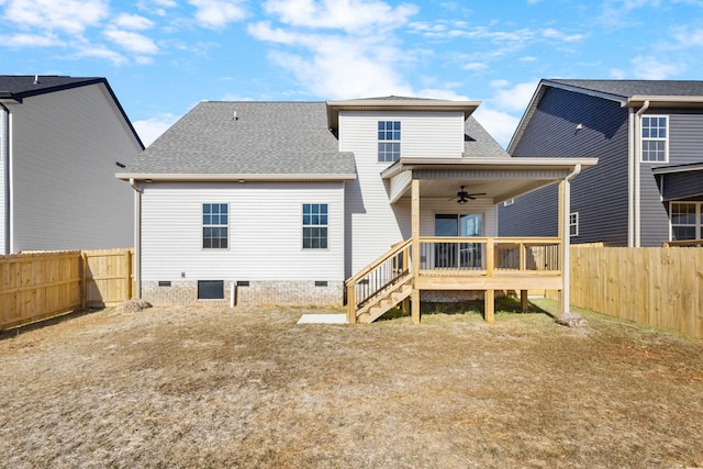 rear view of house with a deck and ceiling fan