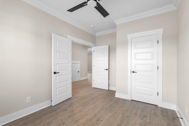 unfurnished bedroom with crown molding, ceiling fan, and light wood-type flooring