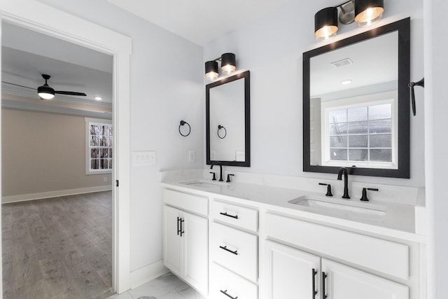 bathroom featuring ceiling fan, vanity, and plenty of natural light