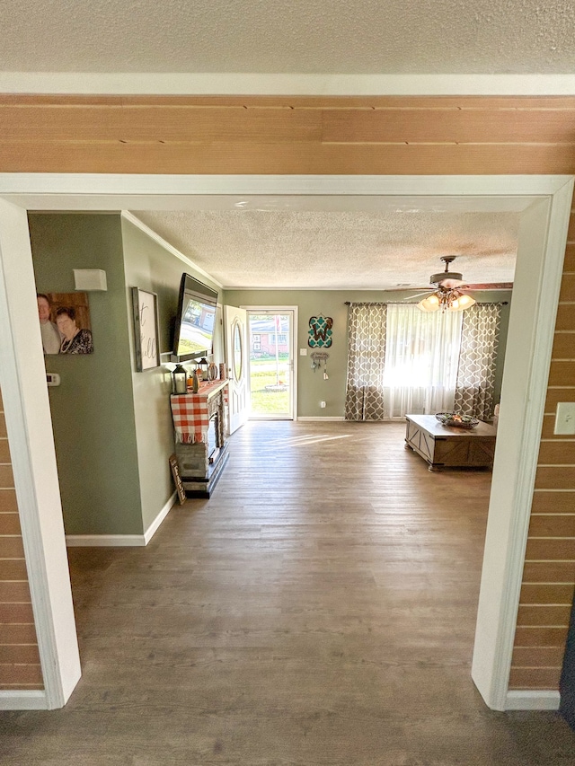 interior space with hardwood / wood-style flooring and ceiling fan