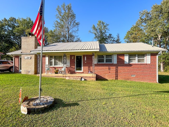 ranch-style house with covered porch and a front yard