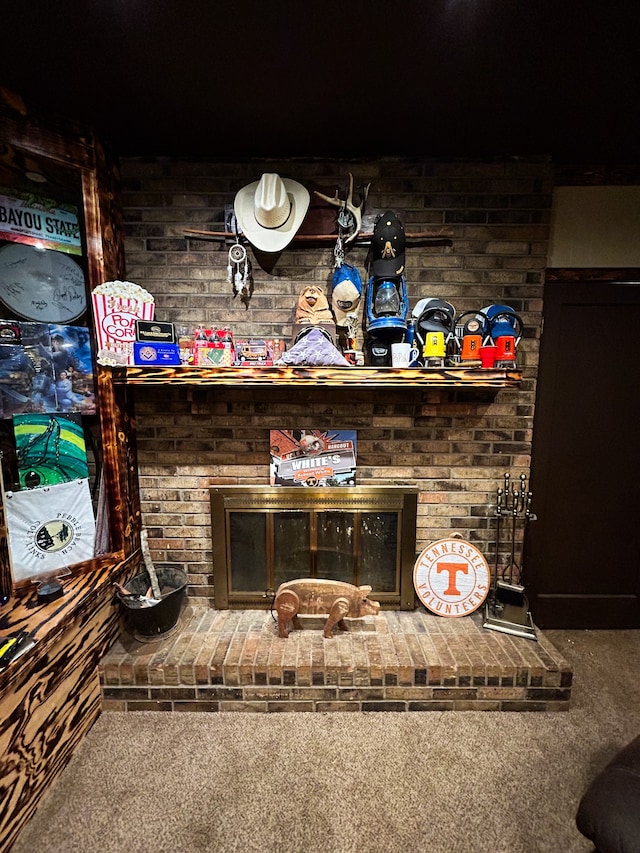 room details featuring carpet floors and a brick fireplace