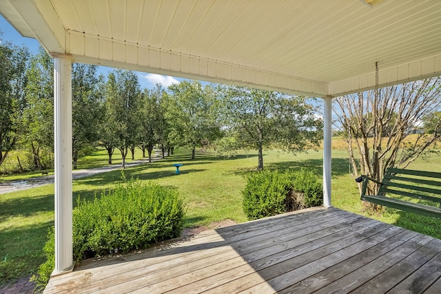 deck featuring a lawn