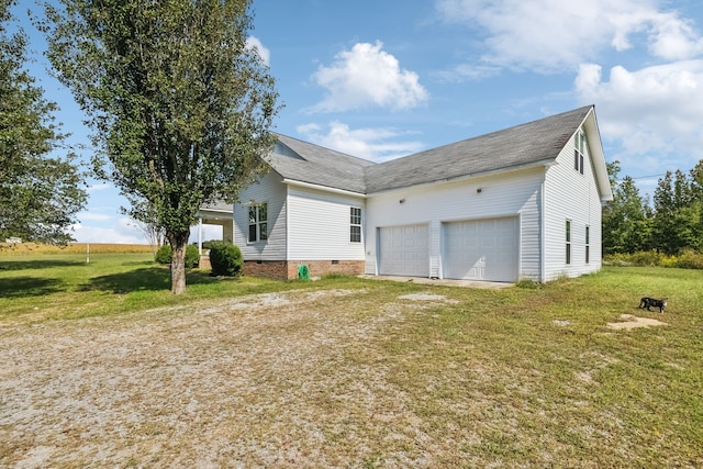 exterior space with a lawn and a garage