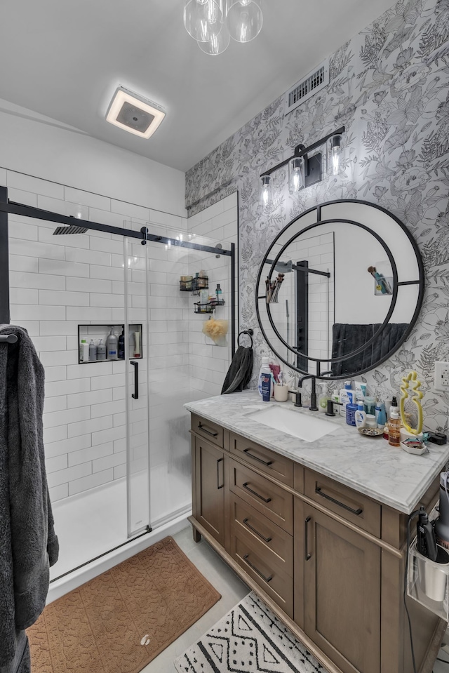 bathroom with vanity and an enclosed shower