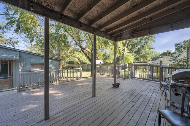 wooden terrace with area for grilling