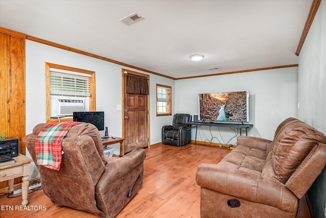 living room with light hardwood / wood-style floors, crown molding, and cooling unit