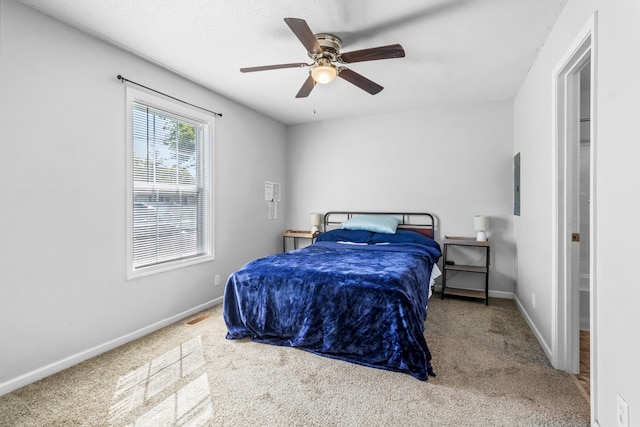 bedroom with ceiling fan and carpet