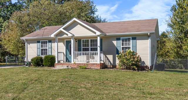 view of front facade with a porch and a front lawn