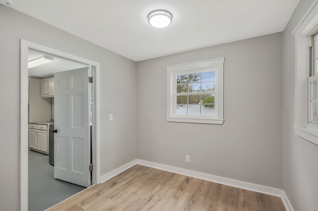 spare room featuring light wood-type flooring