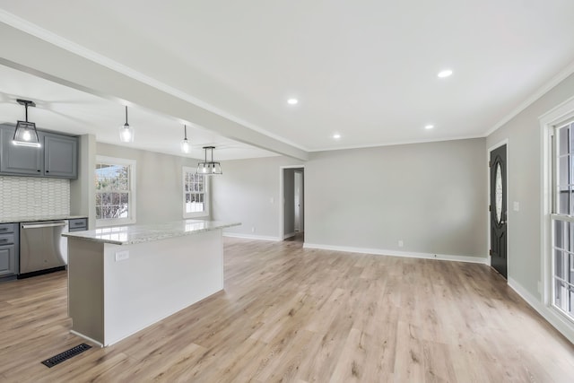 kitchen with a center island, stainless steel dishwasher, pendant lighting, gray cabinets, and light wood-type flooring