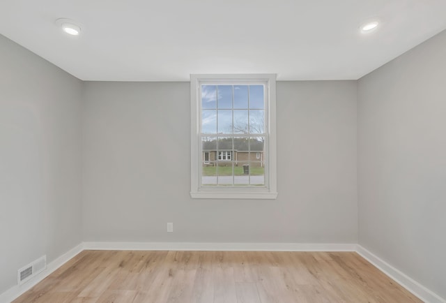 unfurnished room featuring light hardwood / wood-style floors