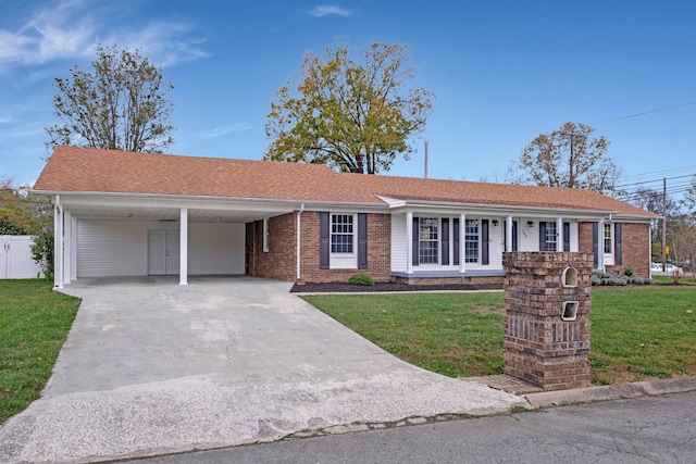 single story home featuring a carport and a front lawn