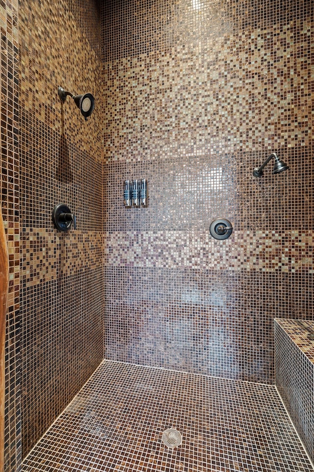 bathroom with tiled shower