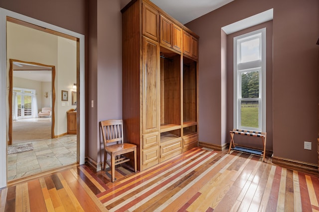 mudroom with light hardwood / wood-style floors