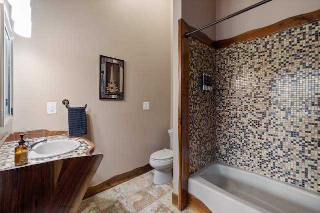 full bathroom with toilet, tiled shower / bath combo, and vanity